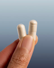 Close-up of The Nue Co capsules highlighting antioxidant-rich formula.