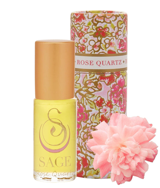 The Sage Lifestyle Rose Quartz Roll On bottle on a vanity, long-lasting floral scent for daily wear.