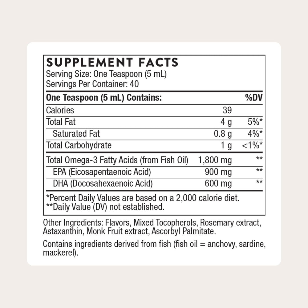 Pouring Thorne Omega Superb lemon-berry oil for convenient dosing