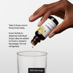 THORNE bottle beside glass demonstrates serving size for daily use.