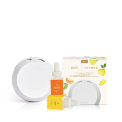 Thymes Pura 4 diffuser on a shelf creates a balanced living room ambiance