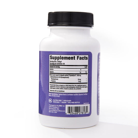 Full-spectrum black seed oil pour from ThymoQuin bottle emphasizing purity and concentration.