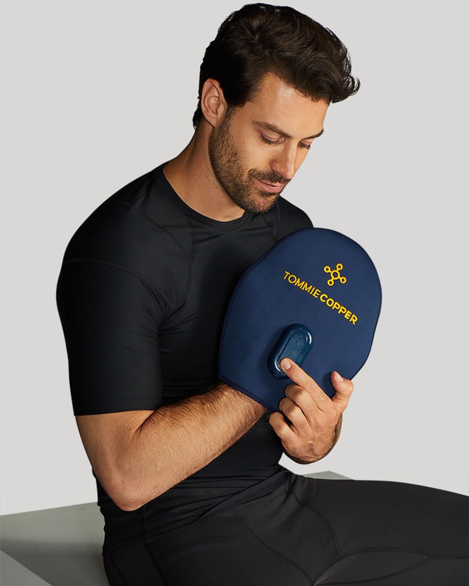 Tommie Copper mitt, hand wrap closeup, provides targeted warmth and comfort during therapy sessions.