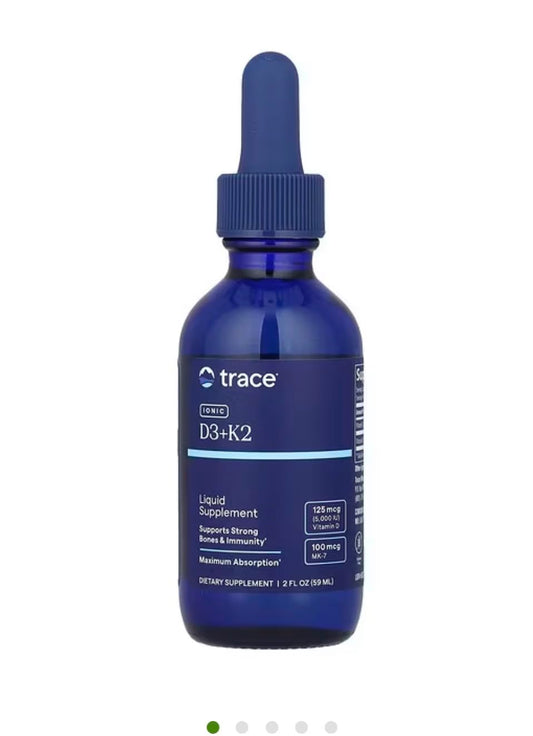 Trace Minerals liquid ionic D3 and K2 bottle pour highlighting easy dosing for bone and immune support.