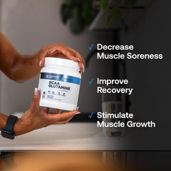 Hands holding a Transparent Labs BCAA Glutamine serving scoop