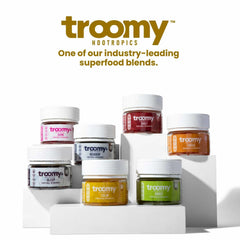 Troomy Reishi Calm Gummies glass bottle on desk for daily calm ritual