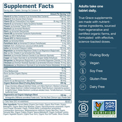 Close-up of True Grace multivitamin label highlighting fermented minerals and organic ingredients.