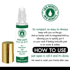 Twin Monkeys Oil Roll-On being applied to the forehead for calming aromatherapy.
