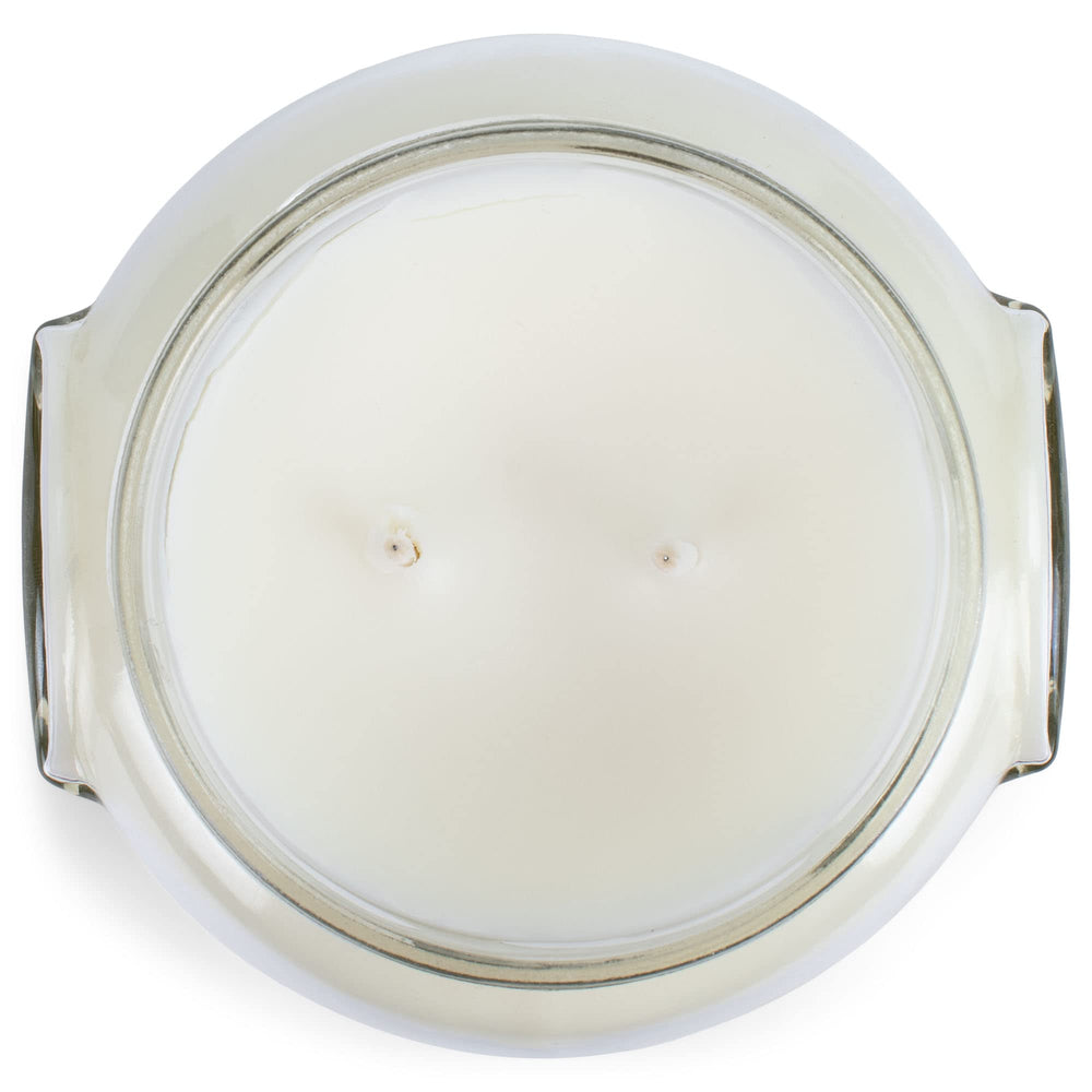 Tyler Creamy White 11 oz glass jar candle on a counter for decor.