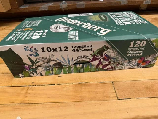 Underberg straw-paper-wrapped bottle highlights portable single-serve digestion aid.