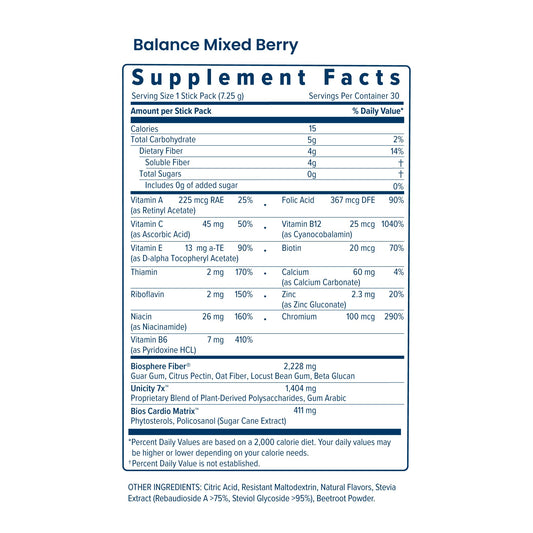 Unicity Balance Mixed Berry powder stirred in a glass for a berry flavor boost.