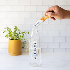 Box of Unicity Balance Natural Orange packets for daily on-the-go use.