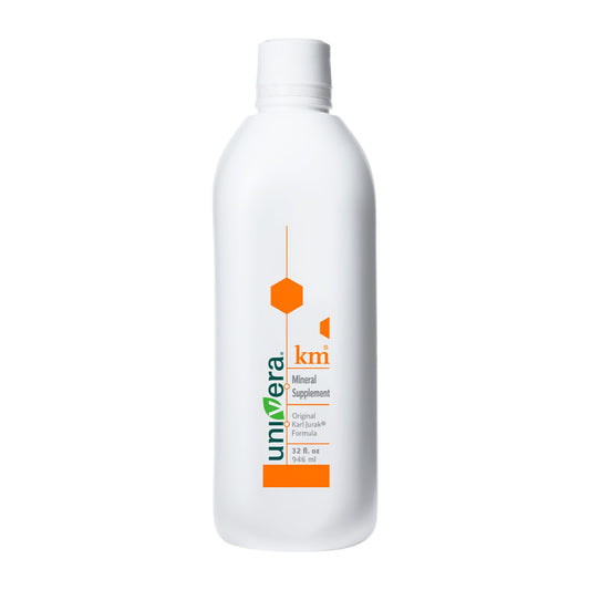 Univera KM bottle front shows the earthy mineral formula for daily support.