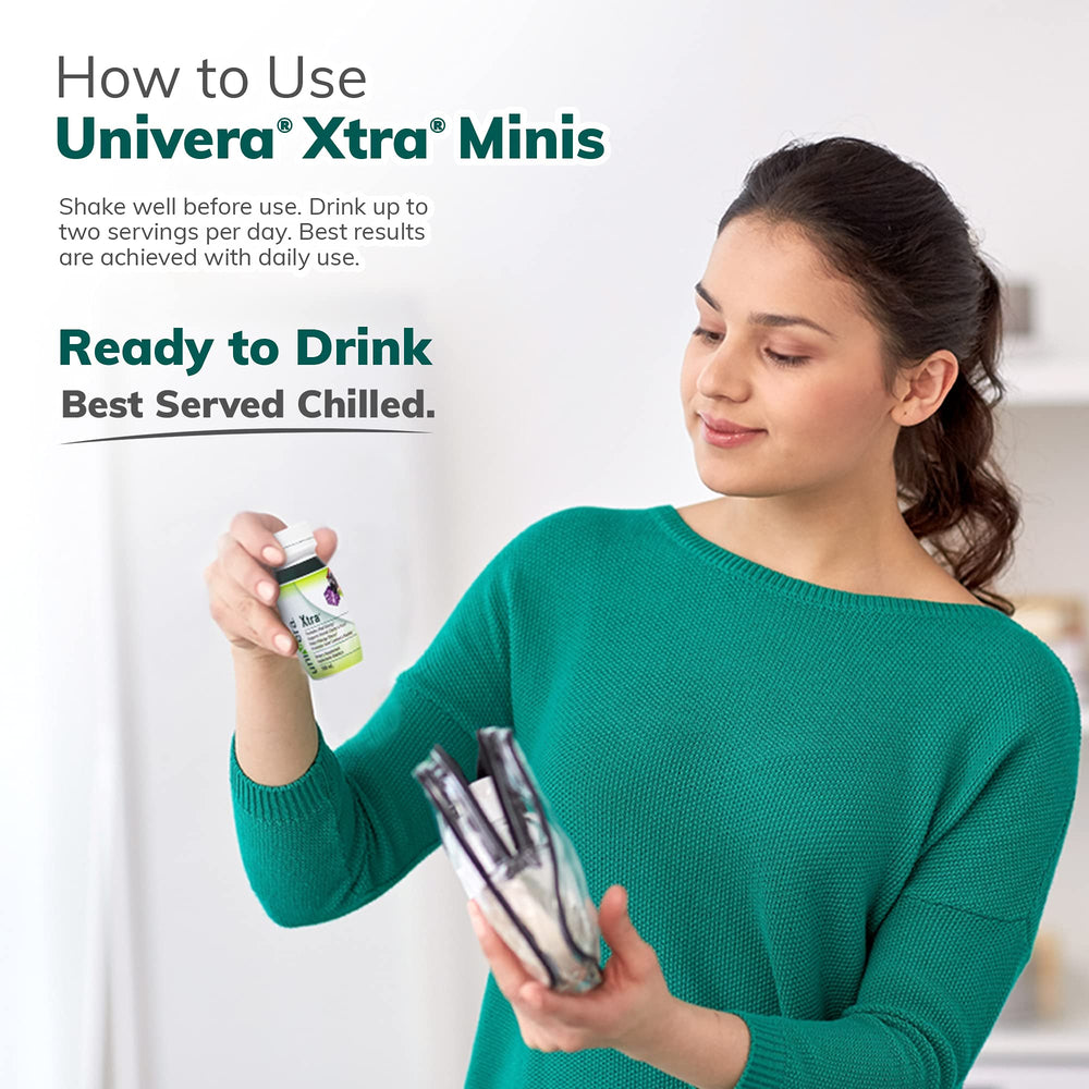 Univera Xtra Minis bottle beside a glass ready for a shot
