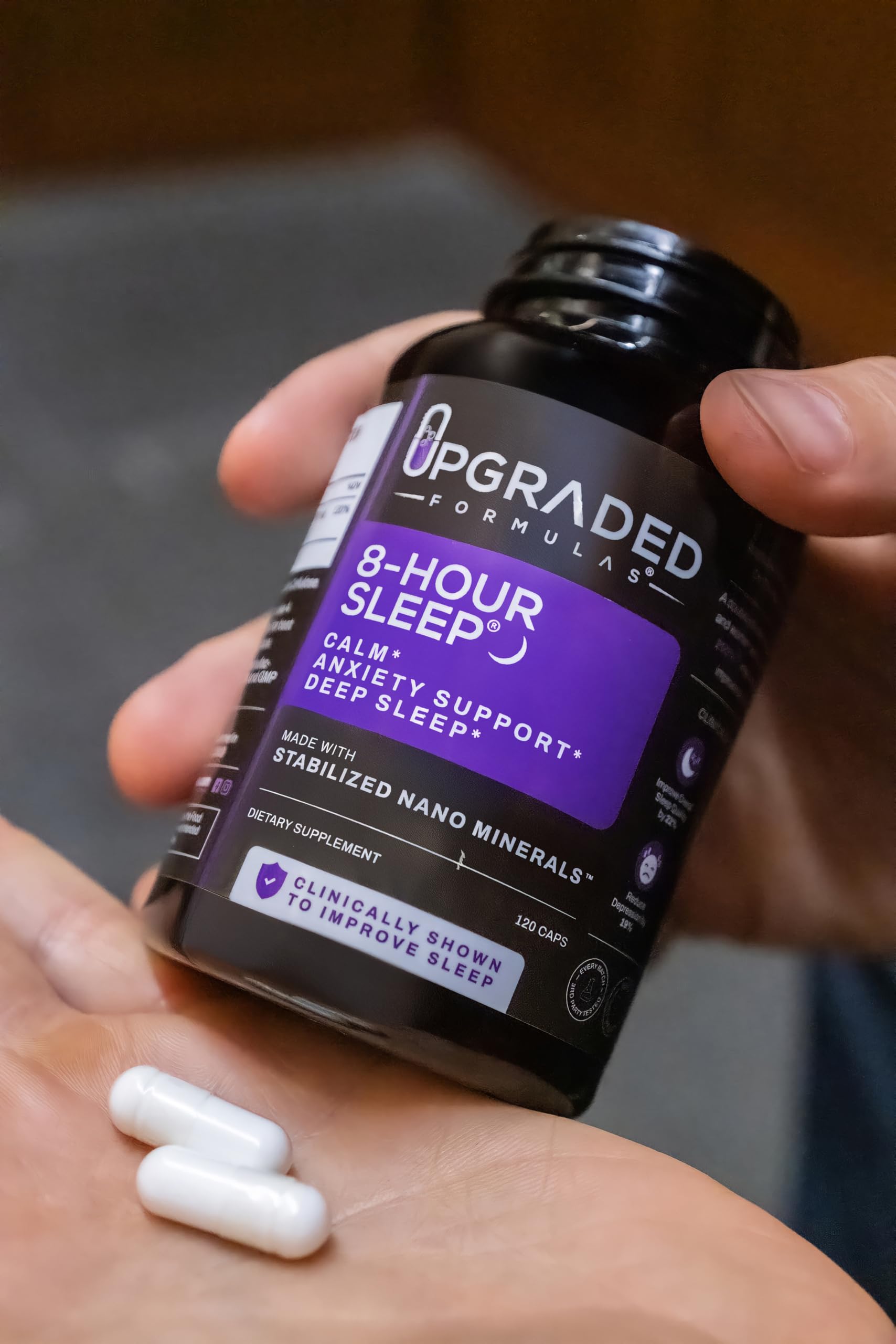 Upgraded Formulas 8-Hour Sleep night-time scene with water promotes relaxation before bed.