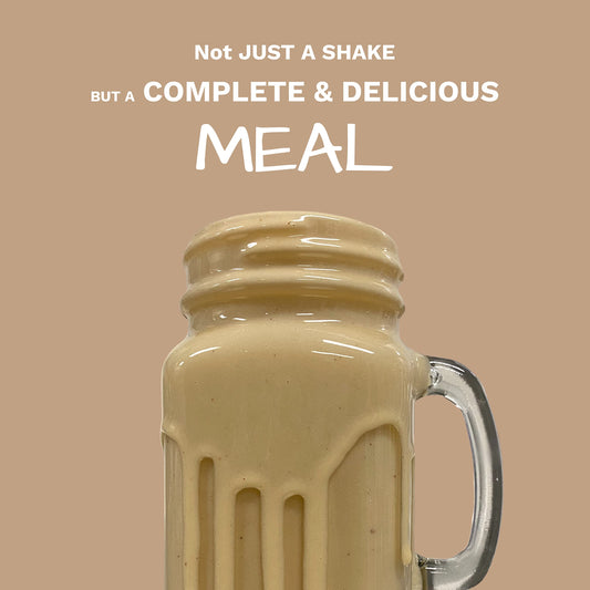 UpNourish protein powder scoop beside glass illustrates quick protein intake.