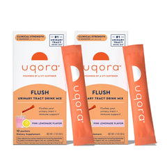 Uqora Flush pink lemonade packet poured into water for daily urinary routine