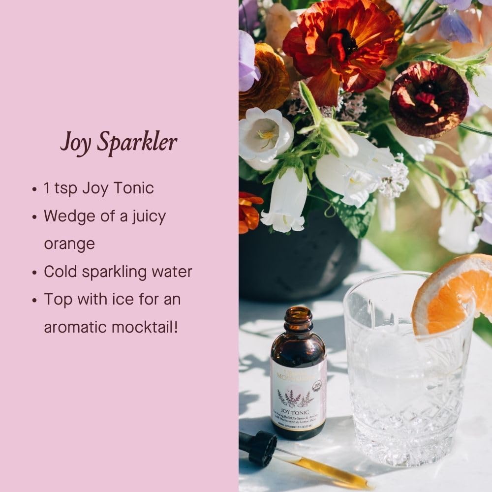 Urban Moonshine Joy Tonic amber bottle close-up signaling on-the-go mood support.