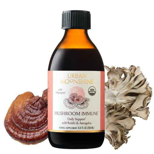 Urban Moonshine Mushroom Immune bottle being poured for daily immune support.