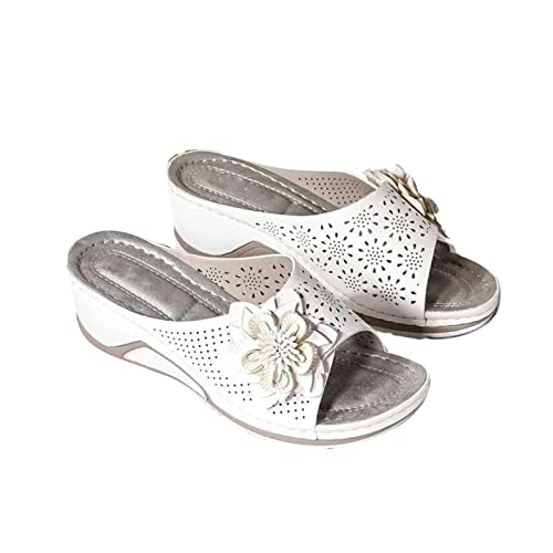 Vannida white 3D floral cutout sandal highlighting feminine design and comfortable fit.