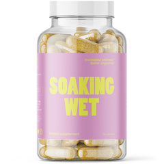VB Health Soaking Wet bottle and capsules on counter, supporting vaginal health