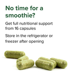 Vibrant Health Green Vibrance bottle open with capsules ready to swallow.