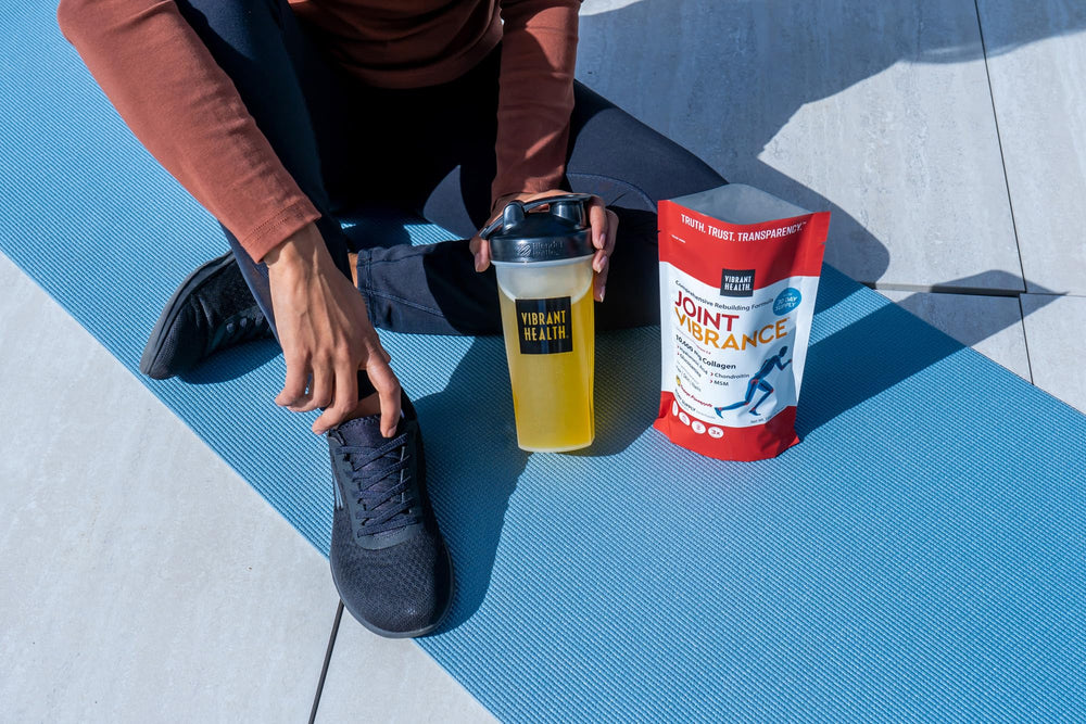 Vibrant Health Joint Vibrance serving idea shows powder mixing in a glass.