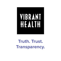 Closeup label on Spectrum Vibrance emphasizing vegan formula and antioxidant blend.