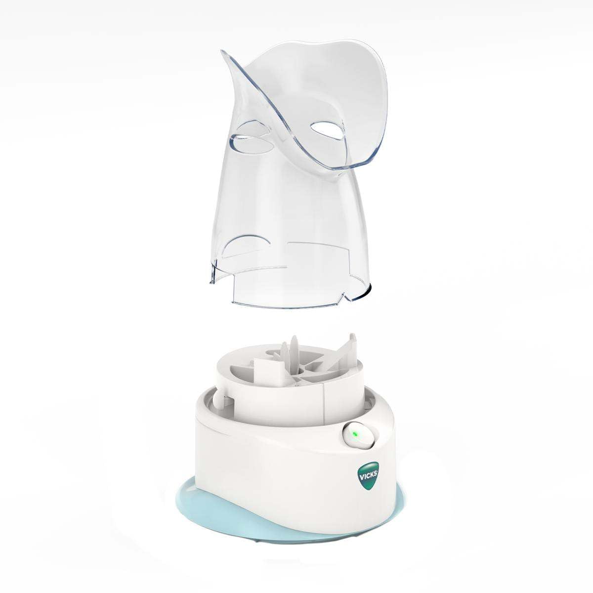 Soft hood resting on the face of a user with the Vicks inhaler.