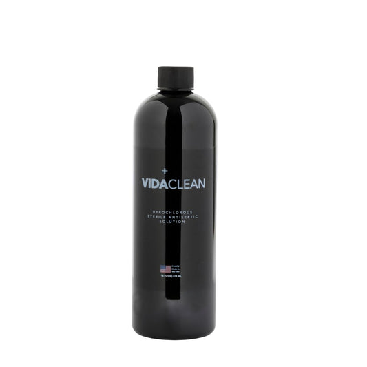 VidaSolutions VidaClean bottle pour demonstrates gentle antiseptic action for skin care.