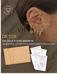 Vie Healing ear seeds on ear demonstrate discreet wearable wellness.