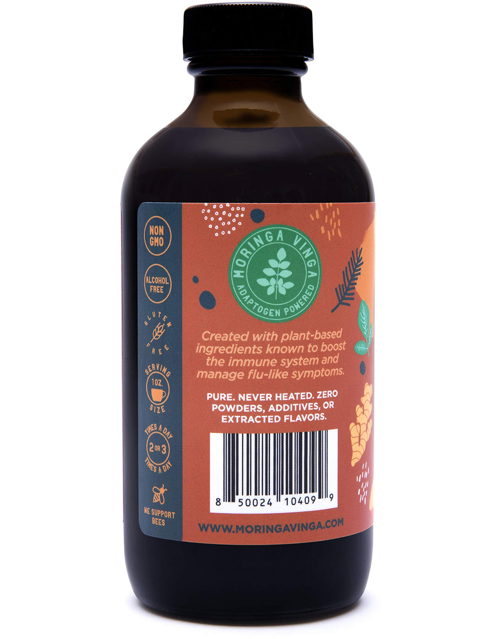Fresh moringa leaves and apples beside the Lava bottle to highlight ingredients.