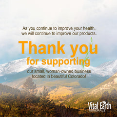Vital Earth Minerals 30-day supply shown beside a glass of water for daily use