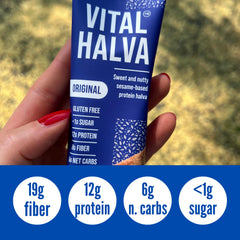 Vital Halva packaging on wooden surface showcases premium sesame snack.