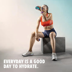 Vitalyte lemon flavor scoop context demonstrates precise two-scoop measure for optimal hydration.