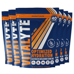 Vitalyte orange electrolyte powder container for quick hydration during workouts.