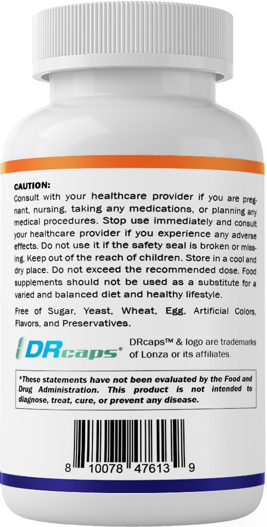 Holding Vitamatic bottle with daily-use label for routine supplementation.