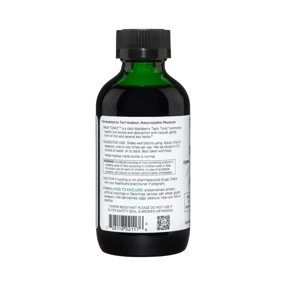 Pour scene of Vitanica Iron Tonic showing convenient daily serving.
