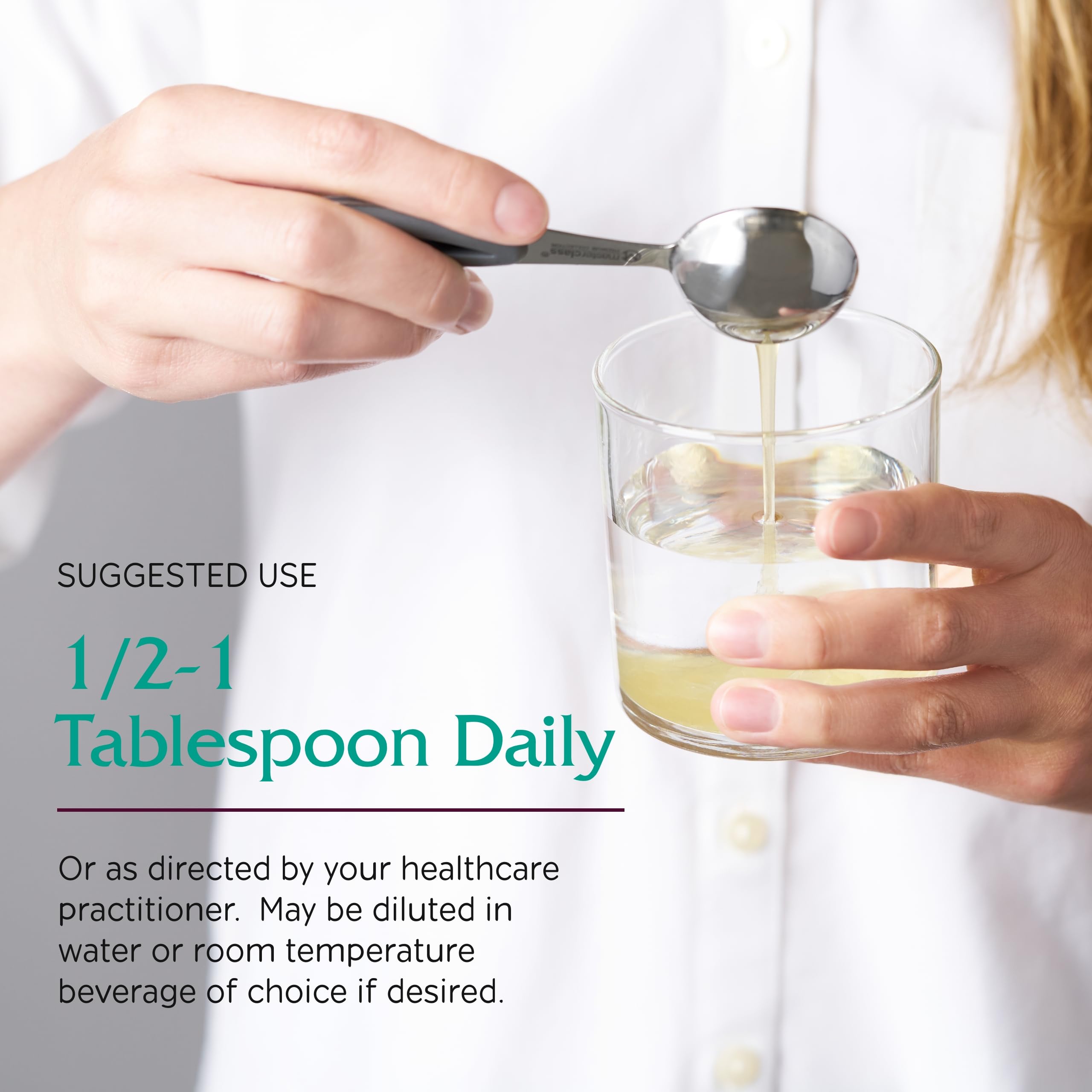 Dosing spoon with Vitanica Magnesium Tonic showing a measured serving