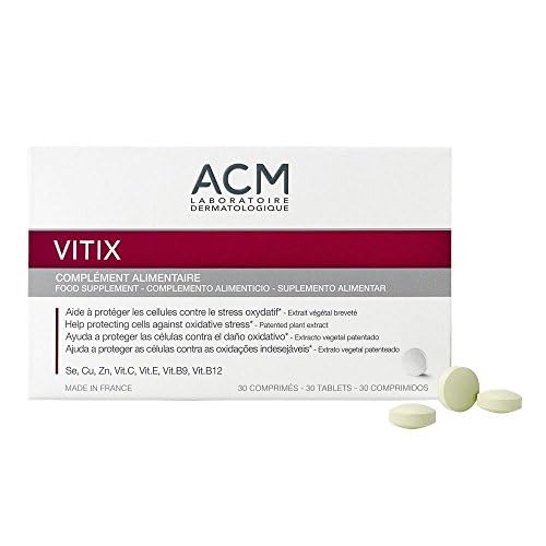 Close-up of Vitix ACM tablets with smooth coating for easy swallowing.