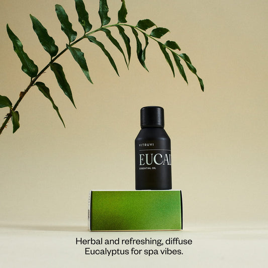 Vitruvi Eucalyptus essential oil bottle—side view, preserved freshness with UV cap.