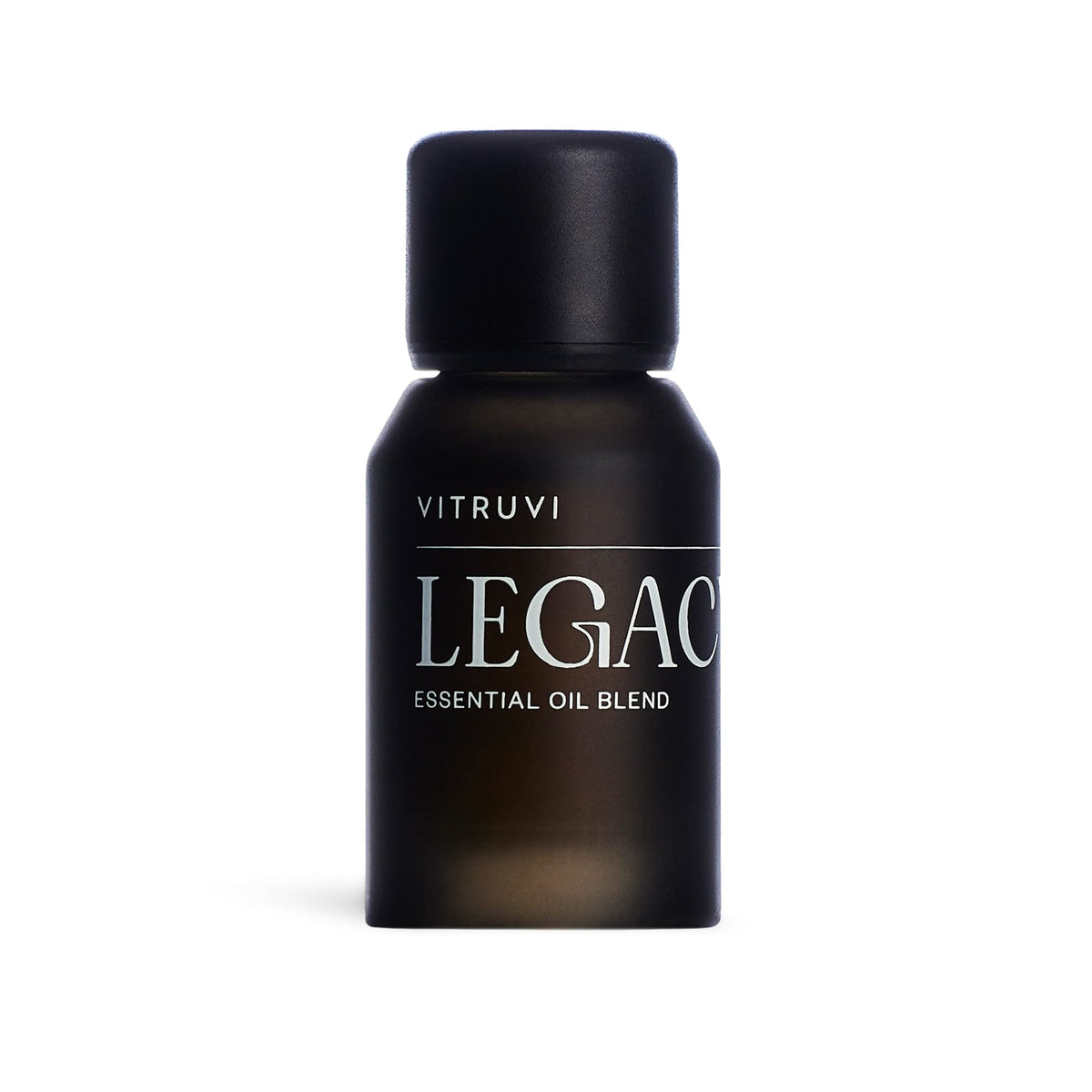 Vitruvi Legacy Woodsy Blend bottle highlights rose, bergamot, and cedarwood notes for calming diffusion.