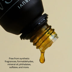 Vitruvi matte black bottle protects aroma from UV light for freshness.