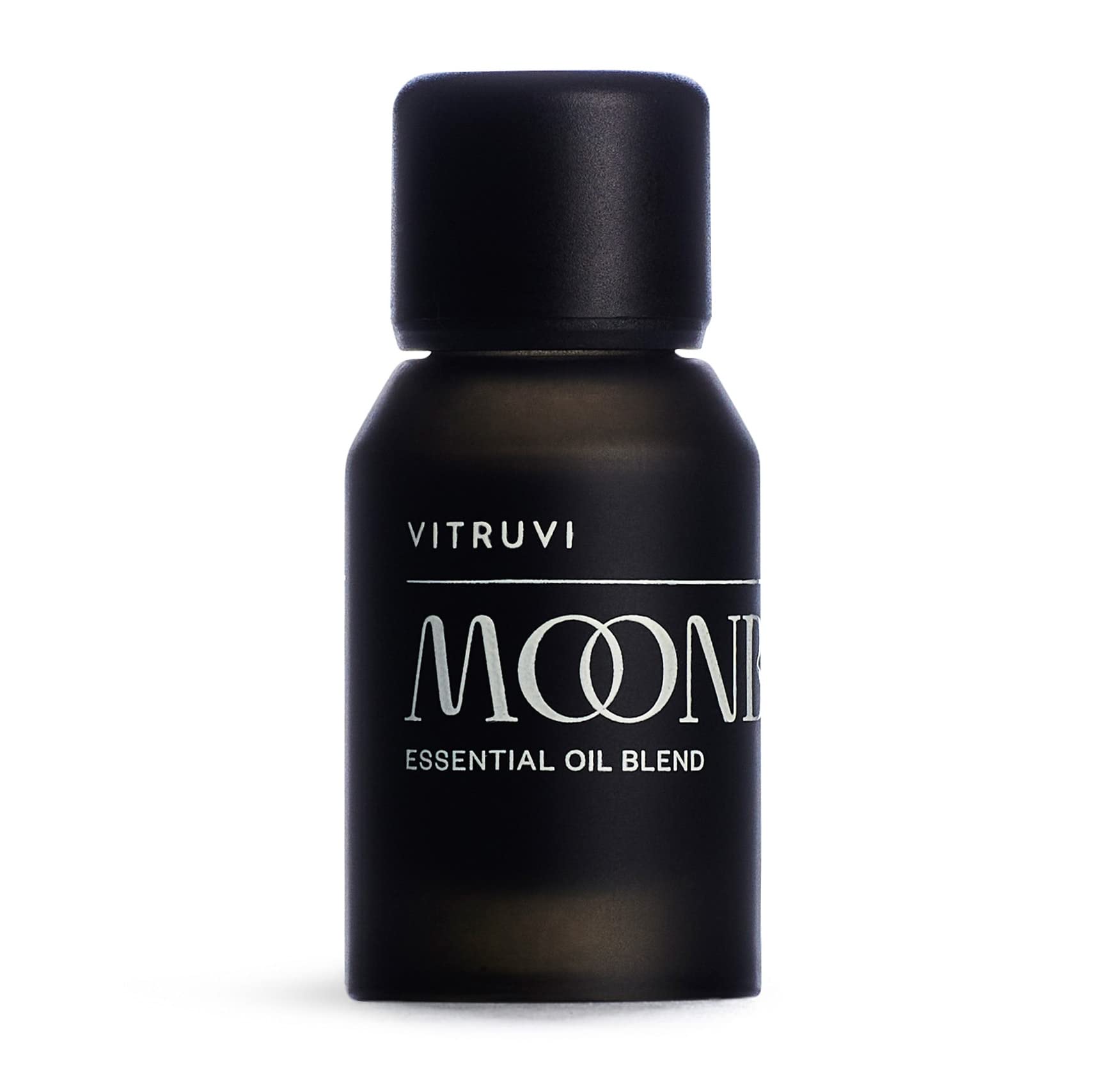 Vitruvi Moonbeam bottle on a wooden surface for a serene, fragrance-rich space.