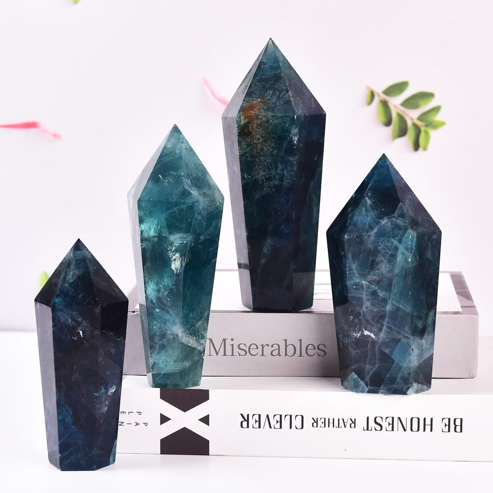 Vizytou green fluorite tower six-faceted wand supports crystal display and meditation practice.