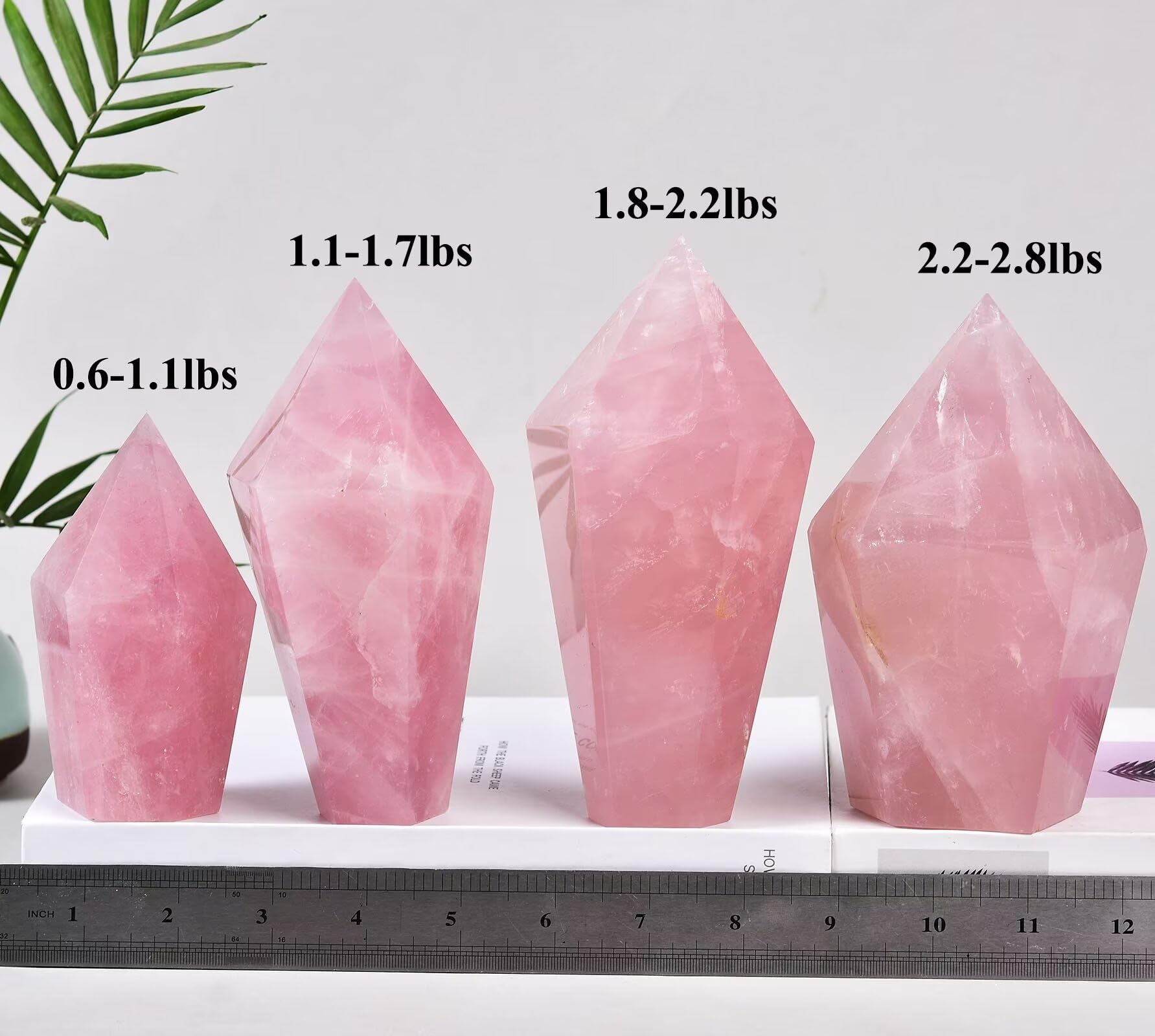 Closeup of VIZYTOU rose quartz obelisk showing natural color and facets.