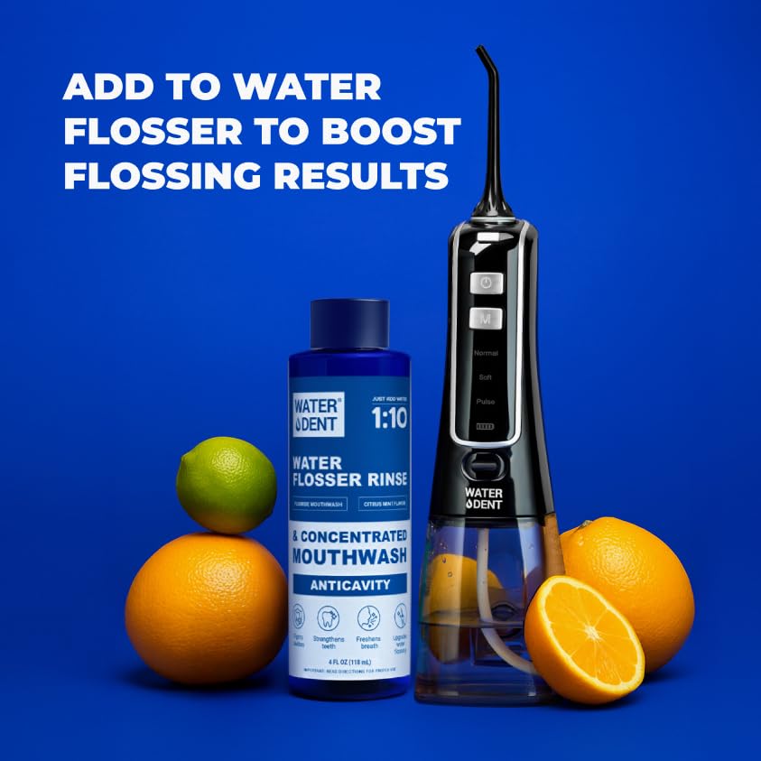 WATER DENT bottle dispensing mouthwash into reservoir during use