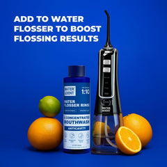 WATER DENT bottle dispensing mouthwash into reservoir during use