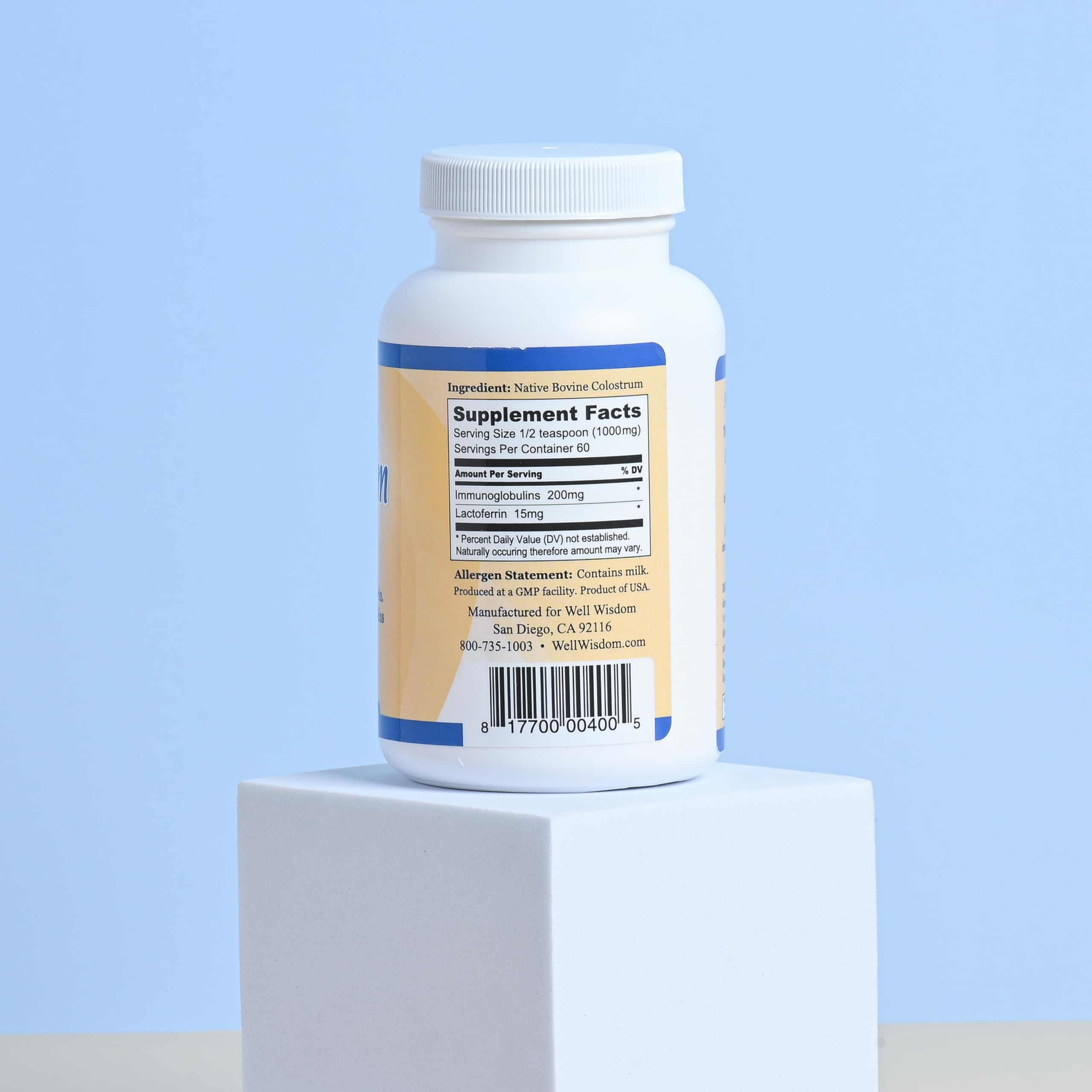 Well Wisdom Grass-fed Colostrum powder bag opened for easy daily mixing.