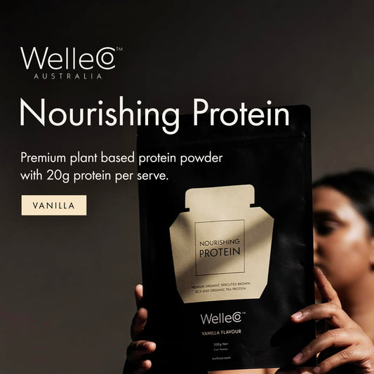 WelleCo Nourishing Protein scoop in glass for post-workout recovery